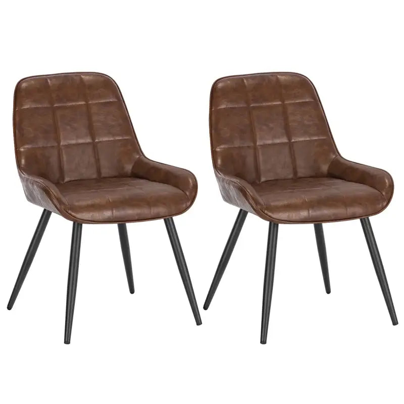 Zwarte metalen poten en witte gestoffeerde zitplaatsen met kussens. Moderne eetkamerstoelen geschikt voor een stijlvolle woonruimte of moderne keuken.