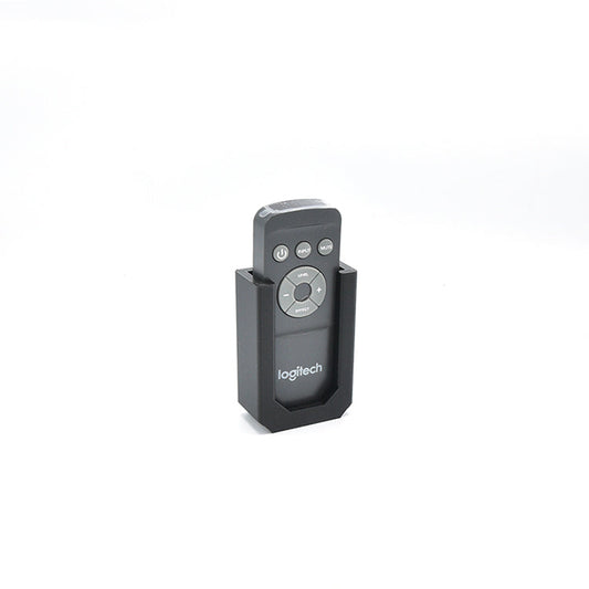 Zwart metaal montagekastje met gat en bijbehorende schroef en bout, geschikt voor camera’s of elektronica. Compacte, robuuste constructie voor professionele montage.
