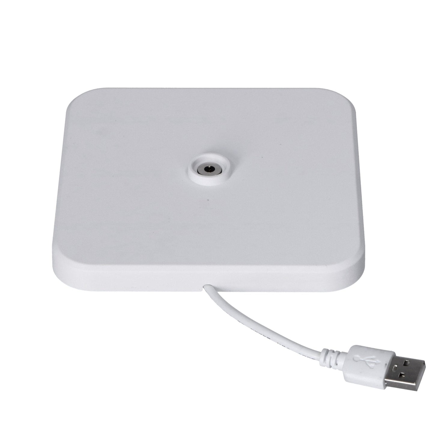 Een witte, minimalistische tafellamp met een gladde, cilindrische kap en een compacte basis. De lamp heeft een zwarte, textuurrijke onderdelen met USB-aansluitingen, geschikt voor moderne interieurs en nachtverlichting.