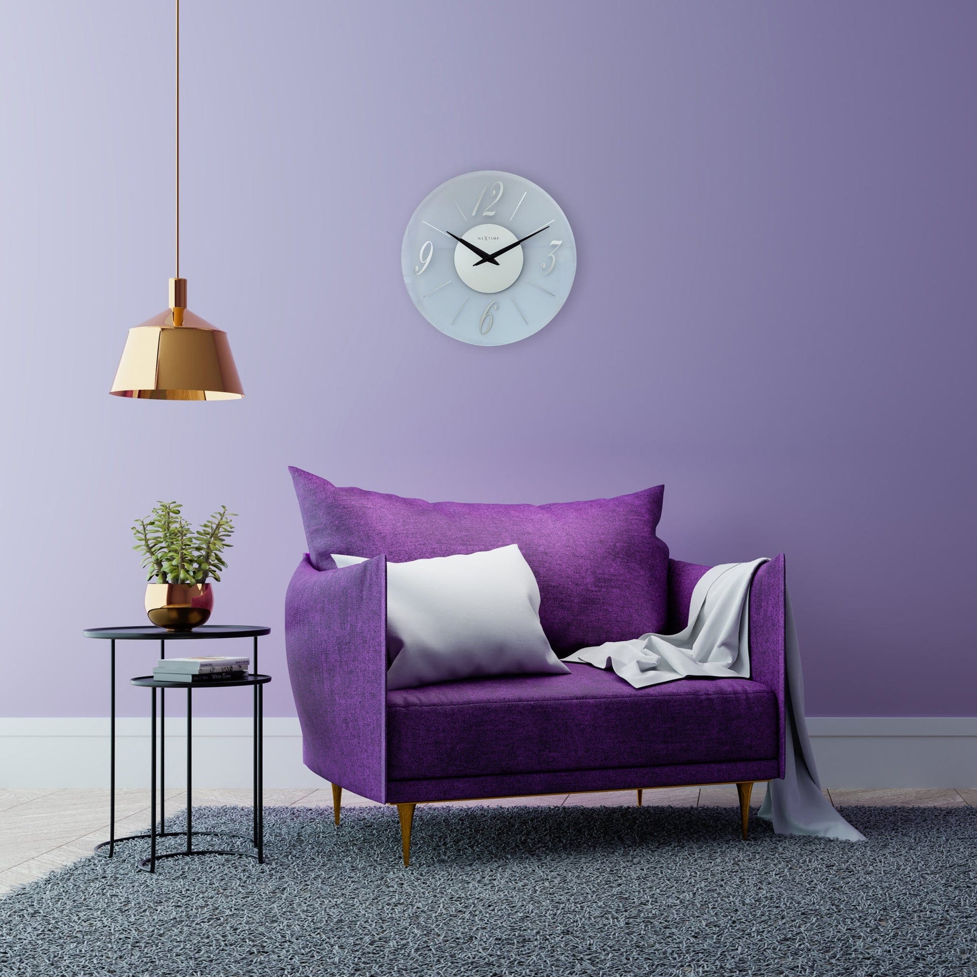 Een moderne wandklok in lichtblauw glas met witte cijfers en zwarte wijzers. Het merk 'NEXTIME' is zichtbaar op de centrale witte cirkel. Geschikt voor woonkamer of kantoordecoratie.