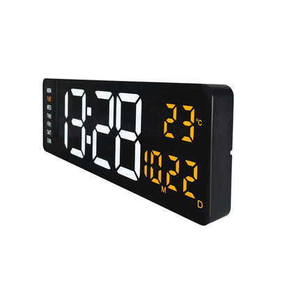 Een zwarte digitale wekker met witte tijdweergave en gele temperatuurindicatie, inclusief dag van de week. Ideaal voor kantoor of slaapkamer als moderne tijd- en temperatuurscherm.