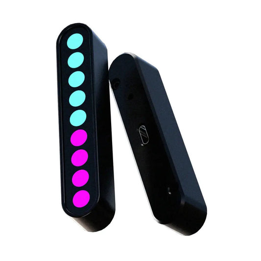 Zwart, cilindrisch LED-lampje met acht kleurrijke lichtpunten – blauw en paars – geschikt voor feestelijke verlichting. Compacte, moderne vorm voor nachtfeesten en evenementen.