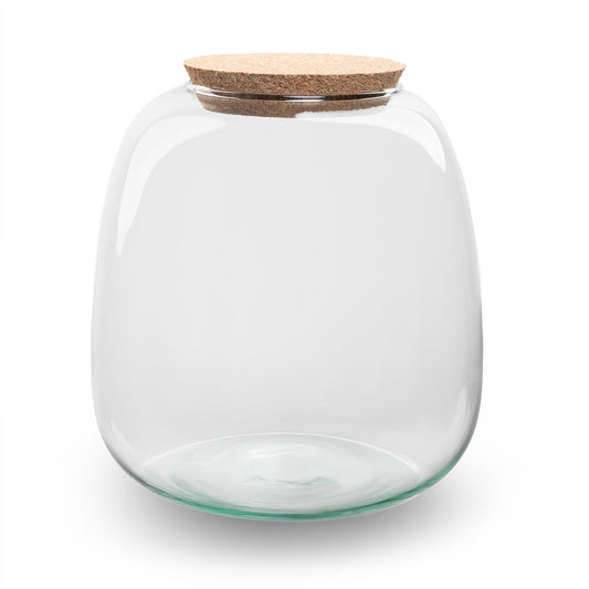 Een transparante glazen pot met een natuurlijke kurk dop, geschikt voor het opslaan van snoep of kruiden. Ideaal voor keuken- en badkameropslag met een minimalistisch design.