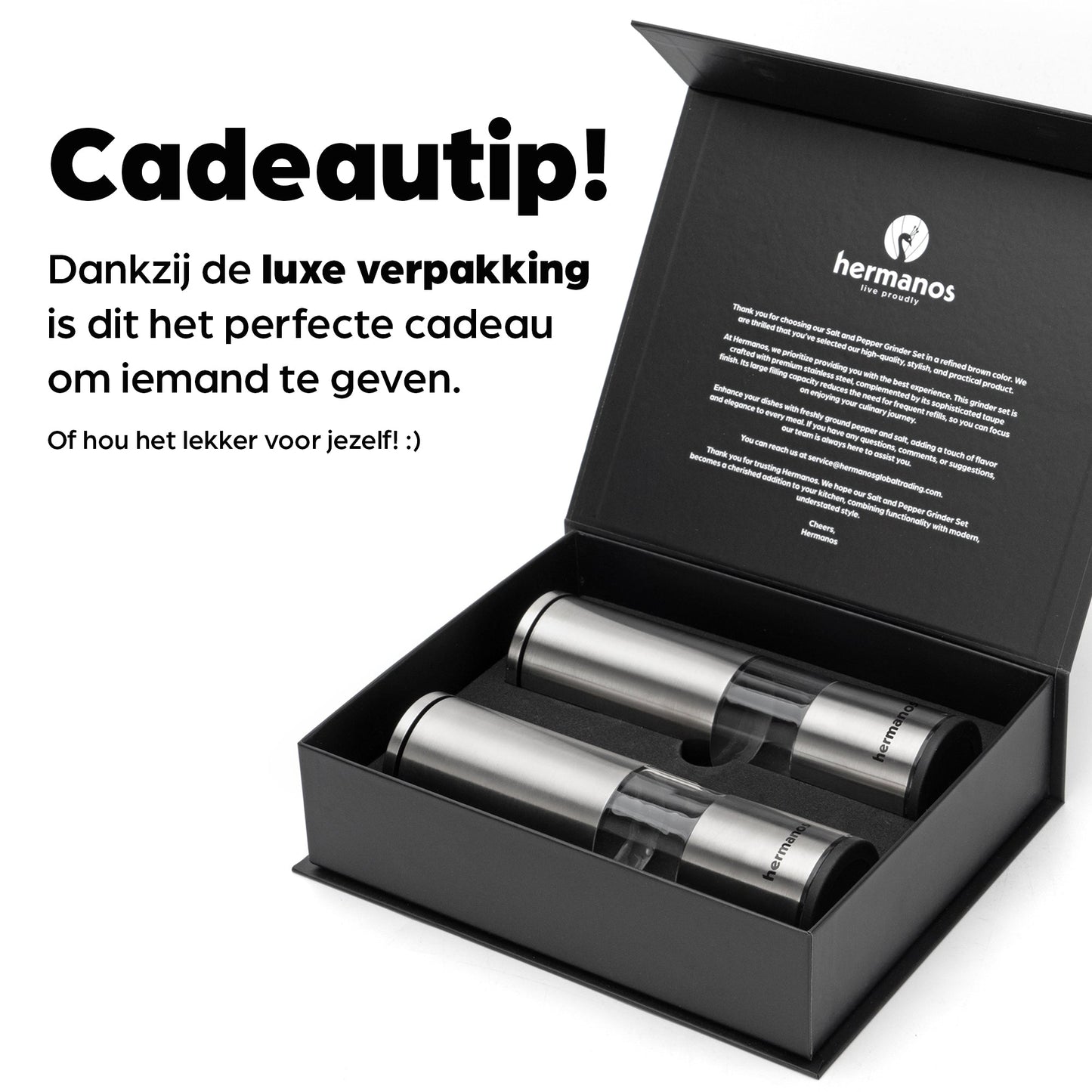 Zilverkleurige Hermanos elektrische pepermolen en zoutmolen met transparante cilinders, gevuld met kleurrijke peperkorrels en roze zout. Ideaal voor moderne keukens en gourmet kookplekken.