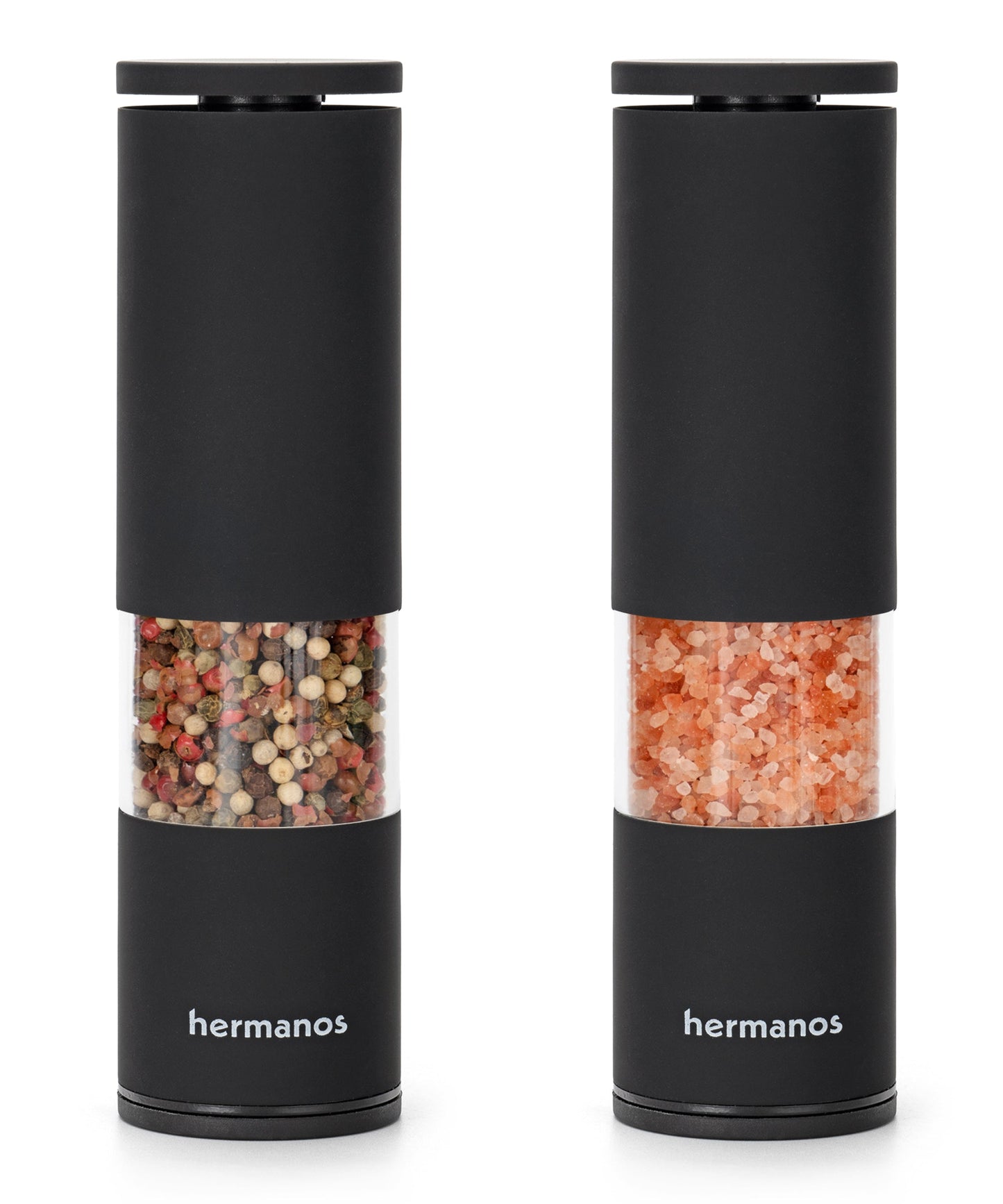 Zwart, cilindrisch pepermolen en zoutmolen van Hermanos, met transparante delen die kleurrijke peperkorrels en roze zout tonen, geschikt voor moderne keukens en gourmet kookplekken.