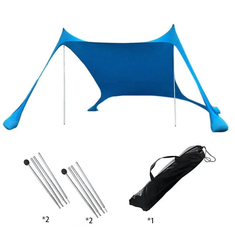 Blauwe zonnescherm tent met metalen stokken biedt schaduw op het strand. Een vrouw in bikini en strohoed ligt op een ligstoel onder de tent, perfect v