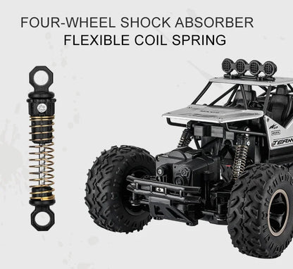 ZWN Rock climber, een zwarte 4WD RC-afstandsbediening met zichtbare goudkleurige velgen, sterk opgezette schokdempers en een robuust alliage frame, sp