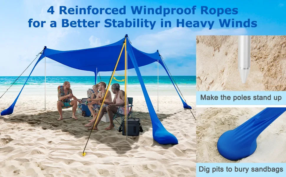 Blauwe beach tent met stalen pootjes biedt schaduw op het strand, waar een vrouw in een zonnebank ontspannen ligt. Ideaal voor zonbescherming tijdens 
