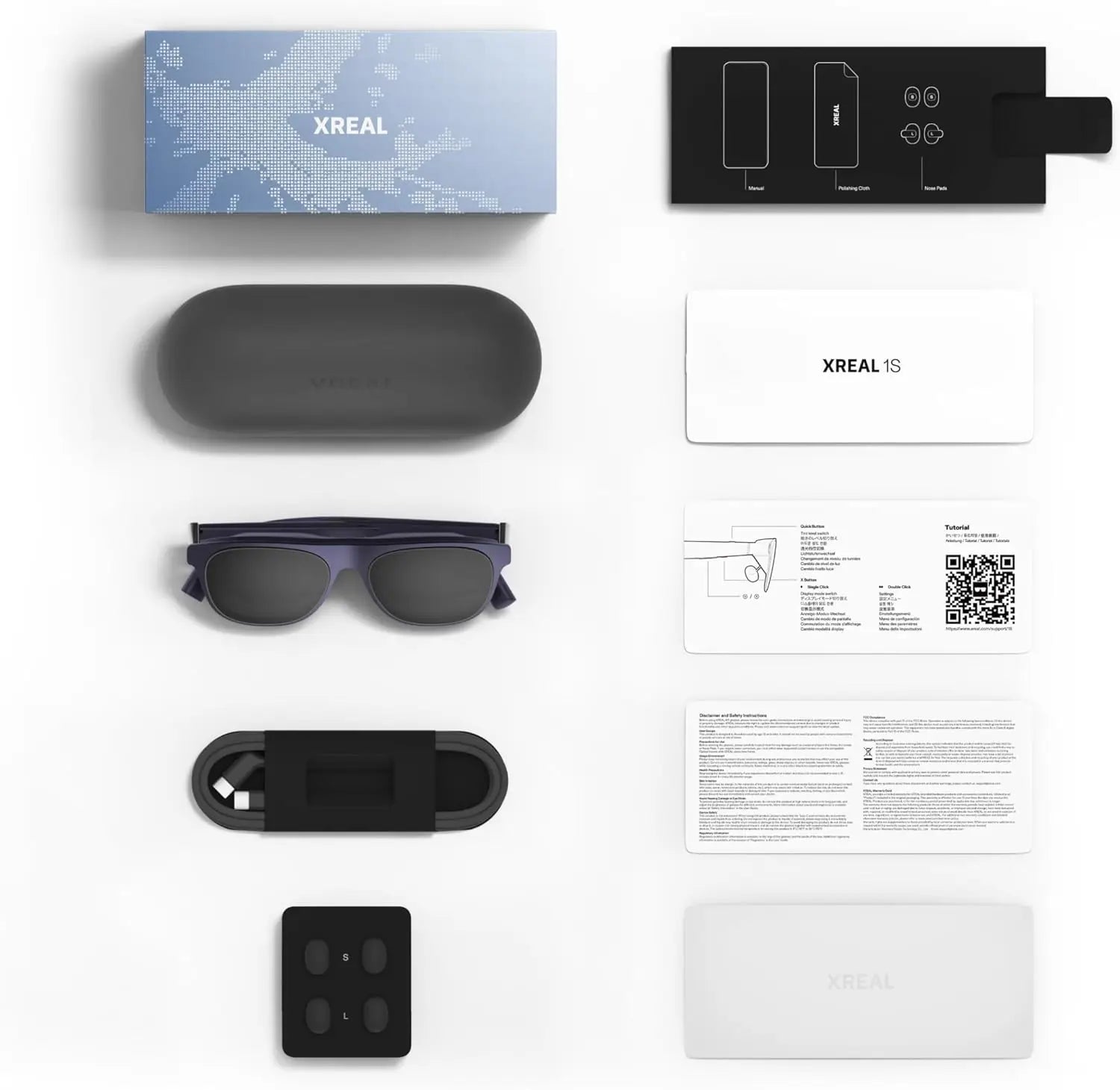 De XREAL 1S AR-bril in donkerblauw met zwart frame, geleverd met oplader, doos en handleiding, geschikt voor mobiele virtuele realiteit en gaming. - F