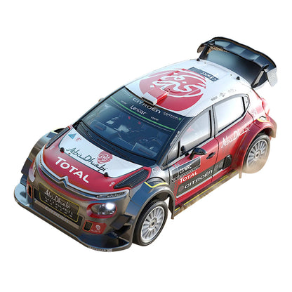 Een 1:7 schaalmodel van een Volkswagen Polo rallywagen in blauw-wit, met zichtbare details zoals de wielophanging en de 'NALES 1' sticker. Geschikt vo