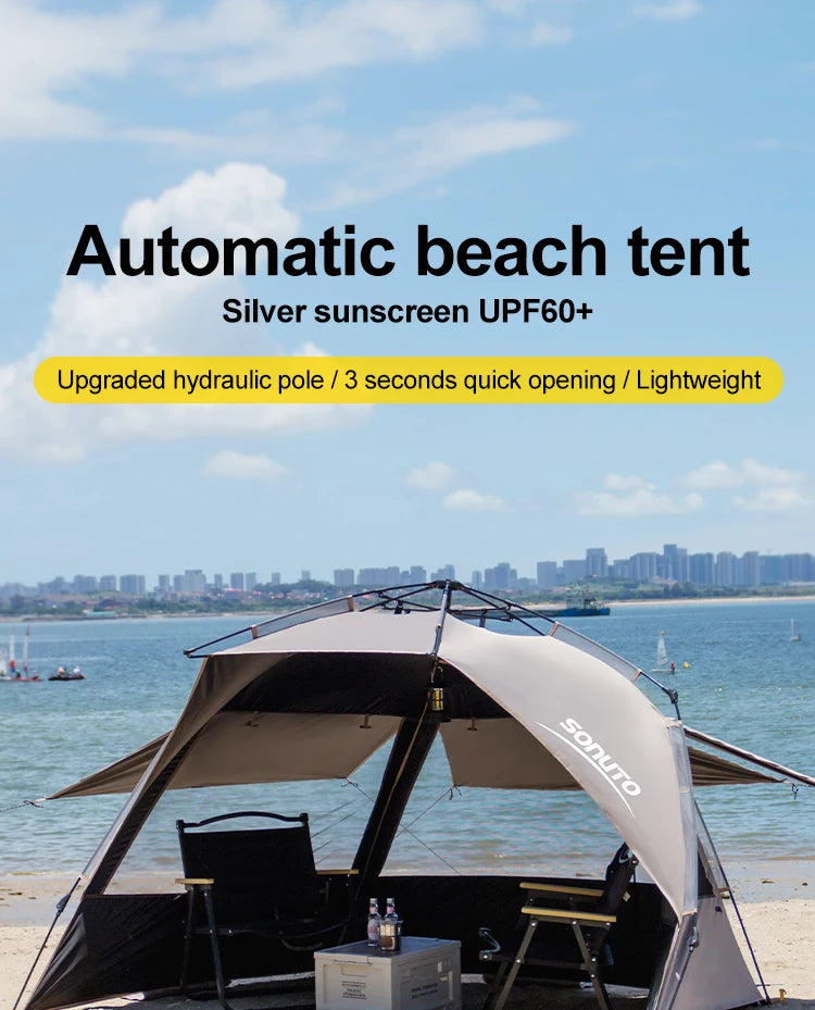 Zilverkleurige, UPF60+ beschermende vinyl zonnescherm op het strand, met lichtgewicht constructie en ruimte voor tafel en stoelen, ideaal voor zonbesc