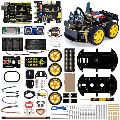Een Keyestudio robotkit met zwarte chassis, gele wielen en diverse elektronische componenten, inclusief sensoren en een microcontroller, voor educatie
