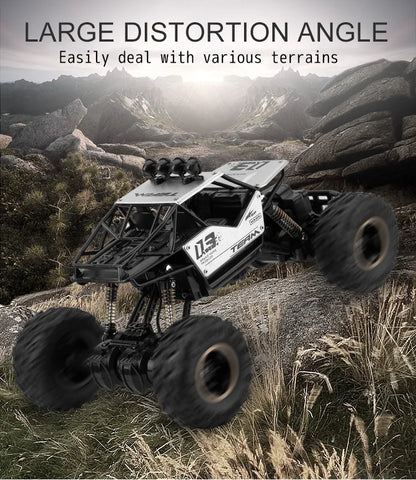 ZWN Rock climber, een zwarte, 4WD RC-afstandsbedieningsauto met goudkleurige velgen en zichtbare schokdempers, geschikt voor off-road avonturen en ste