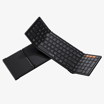 Zwart, vouwbare toetsenbord met flexibele, opvouwbare constructie en oranje functietoetsen, geschikt voor mobiele gebruik en reizen. Compacte, draagbare toetsenbord voor laptop- en tabletgebruik.
