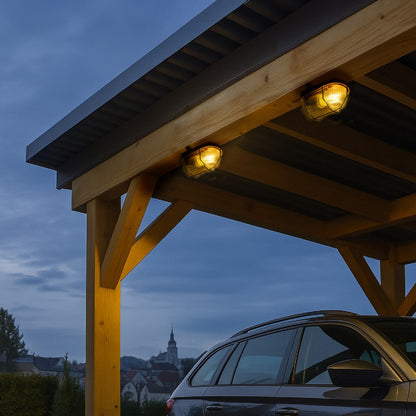 Grijze, afwerking met ribbelstructuur en metalen kooi. Geschikt voor industriële verlichting, met zichtbare montagebeugels en transparante beschermkap.