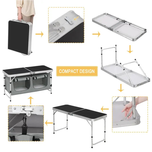 Grijze vouwbare tafel met zwarte oppervlakken en twee opbergvakken onderaan, geschikt voor kampeer- en feestgebruik. Aluminium frame met zwart rubberen voetbescherming voor stabiliteit.