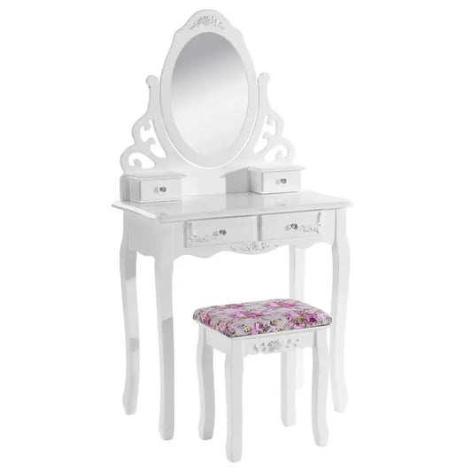 Een witte, klassieke make-up tafel met ovale spiegel en decoratieve details, voorzien van twee laden en een bijpassende kruk met bloemenprint, ideaal voor een romantische slaapkamer of make-up ruimte.