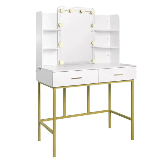Een witte make-up tafel met goudkleurige metalen poten en twee laden, voorzien van een spiegel met omringende lichtjes en open planken aan weerszijden, ideaal voor make-up of sieraden opbergen.