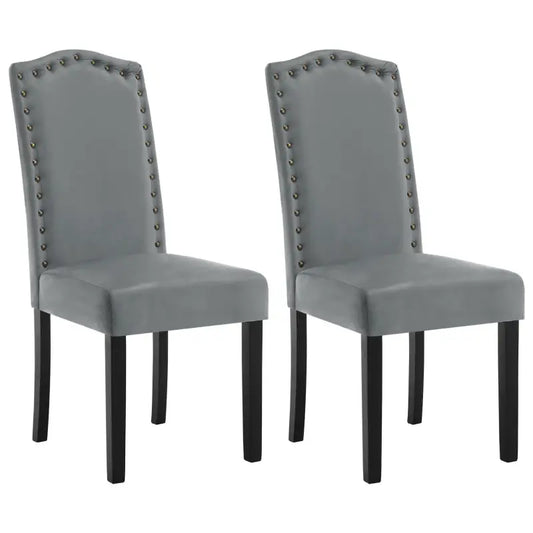 Grijze fluweelstoelen met stiksels en zwarte poten, ideaal voor een moderne eetkamer of woonkamer. Stijlvolle designstoelen voor comfortabele zitplekken.