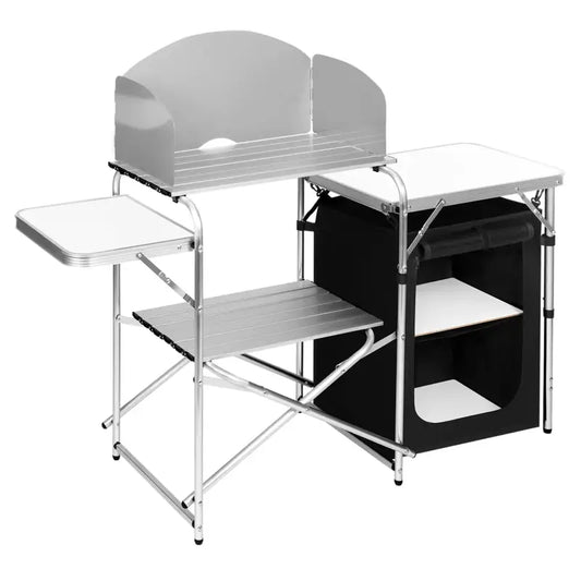 Zilverkleurige vouwbarbecue met opvouwbare werkbladen en houten planken, geschikt voor kamperen en buitenkeuken. Met opbergvak en afdekking voor praktisch gebruik op reis.