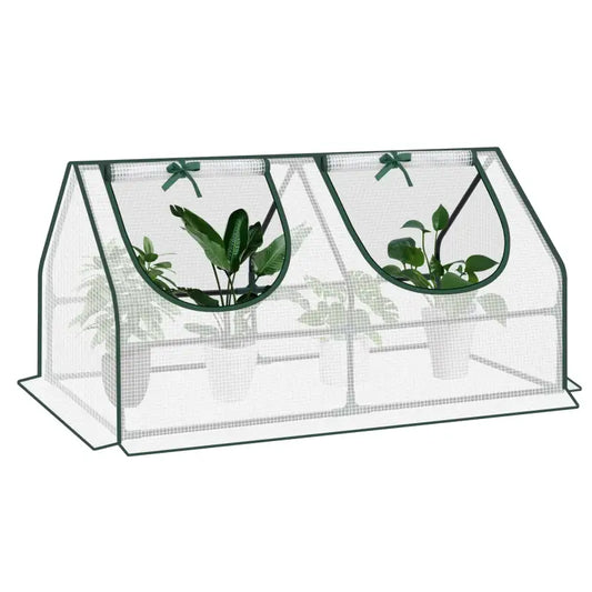 Groene, opvouwbare plantentent met transparante mesh, voorzien van twee boogvormige openingen met groene strikken. Bescherming voor binnen- en buitenplanten tegen insecten en wind.