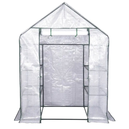 Eenvoudige tuinserre met transparante mesh wanden en groene metalen frame, geschikt voor groenten en bloemen. Ideaal voor kleine tuinen en zomerse kweekprojecten.