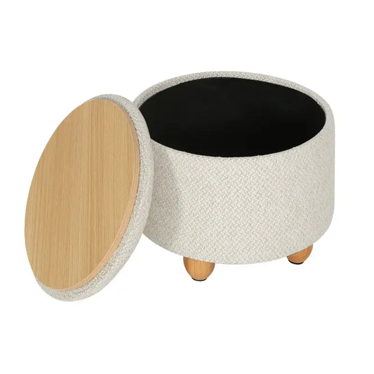 Een ronde, crèmekleurige kussenstoel met textielbekleding en houten poten, geschikt als zitplaats of opbergruimte in een moderne woonkamer of slaapkamer.