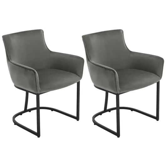 Grijze fluweelstoelen met zachte bekleding en zwarte metalen poten, geschikt voor moderne eetkamer of woonkamer. Stijlvolle designstoelen voor comfortabele zithoeken.