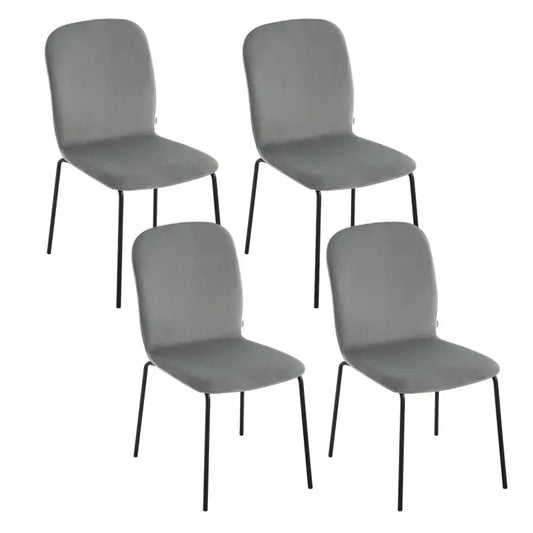 Een set van vier moderne eetkamerstoelen met crèmekleurige fluweelbekleding en zwarte metalen poten, geschikt voor een stijlvolle eetkamer of woonruimte.