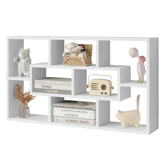 Een witte, geometrische wandkast met meerdere vakken voor decoratieve opslag. Geschikt voor moderne woonkamers of kantoren waar minimalistisch design en functionele opbergruimte centraal staan.