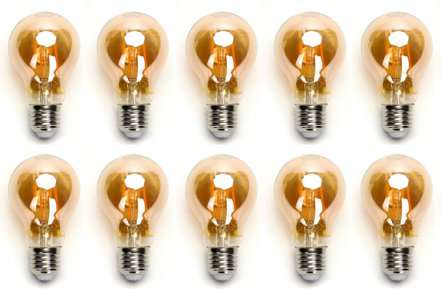 Zes glazen filamentlampen met warm wit licht en zichtbare koperen draden, geplaatst op een witte achtergrond. Perfect voor vintage interieurstijl of sfeerverlichting in woon- en werkomgevingen.