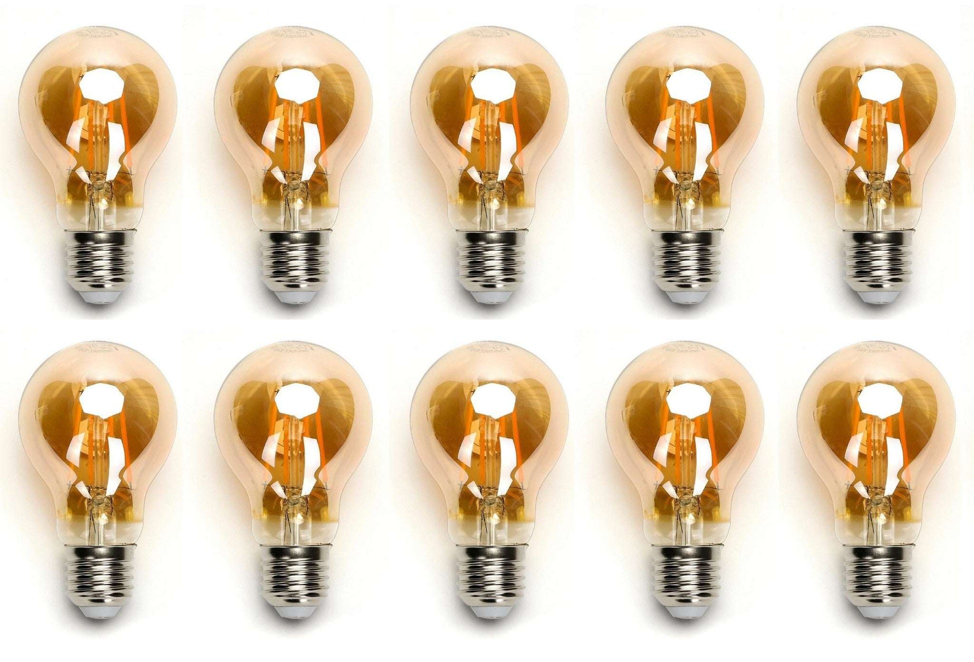 Zes glazen filamentlampen met warm wit licht en zichtbare koperen draden, geplaatst op een witte achtergrond. Perfect voor vintage interieurstijl of sfeerverlichting in woon- en werkomgevingen.