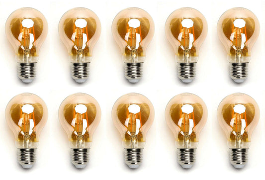 Zes glazen filamentlampen met warm wit licht en zichtbare koperen draden, geplaatst op een witte achtergrond. Perfect voor vintage interieurstijl of sfeerverlichting in woon- en werkomgevingen.