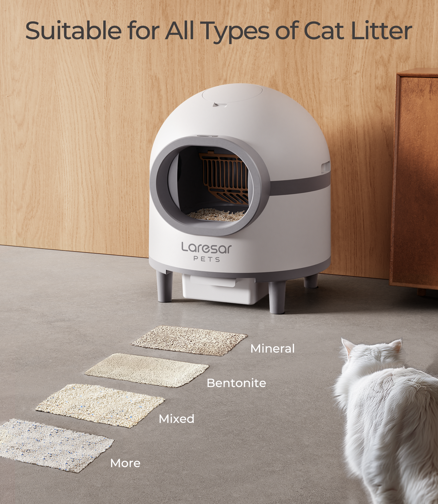 Een witte, moderne automatische katentuig met een zichtbare, witte en grijze vachtige kat erin. Het apparaat heeft een app-gecontroleerde functie voor hygiëne en comfort in de huisdierenruimte.