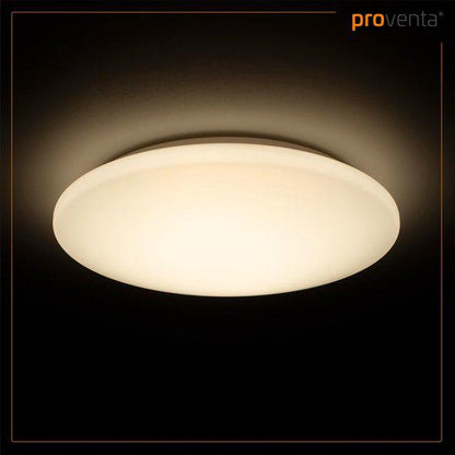 Een witte, ronde LED plafondlamp met glad oppervlak, geplaatst naast haar verpakking. Geschikt voor moderne badkamers of woonkamers met minimalistisch interieur.