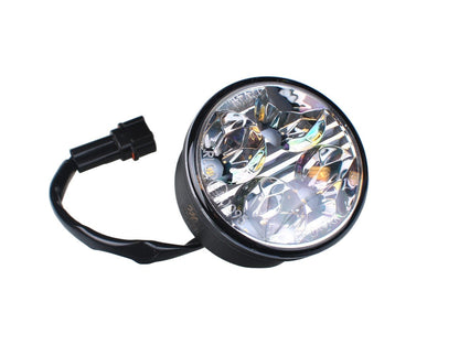 Zwarte ronde LED-verlichting met vier heldere lichtbronnen en glazen lens, voorzien van zwarte stekkerkabels. Ideaal voor gebruik als koplampen of achterlichten op voertuigen.