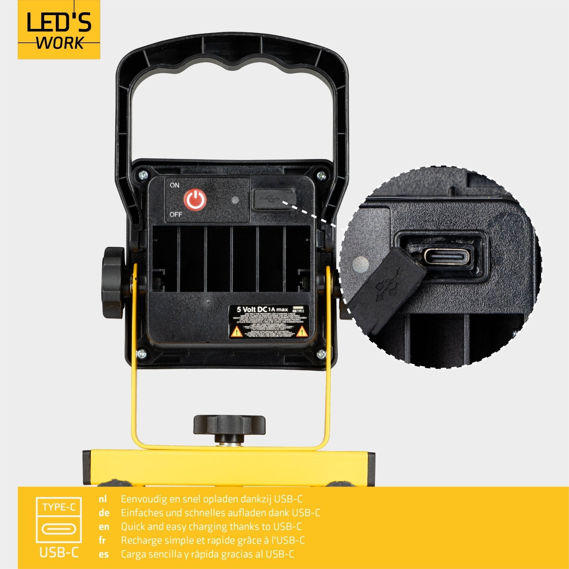 Een robuuste, geel-zwarte LED werklamp met draaibaar hoofd en verstelbare voeten, geschikt voor bouw- en reparatiewerkzaamheden. Zichtbare LED’s en handvat voor gemakkelijke bediening.