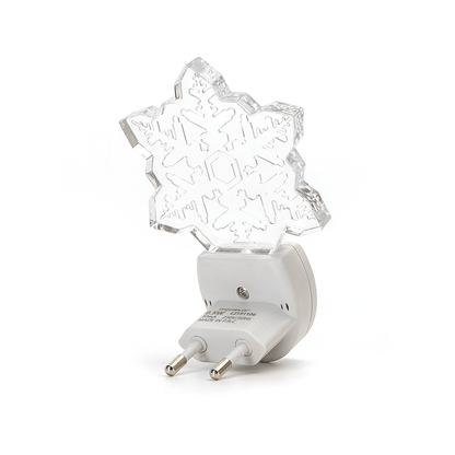 Een witte nachtlamp in de vorm van een sneeuwvlok, gemaakt van glas met ingelegde patronen. Perfect voor sfeerverlichting in slaapkamers of als kerstdecoratie.