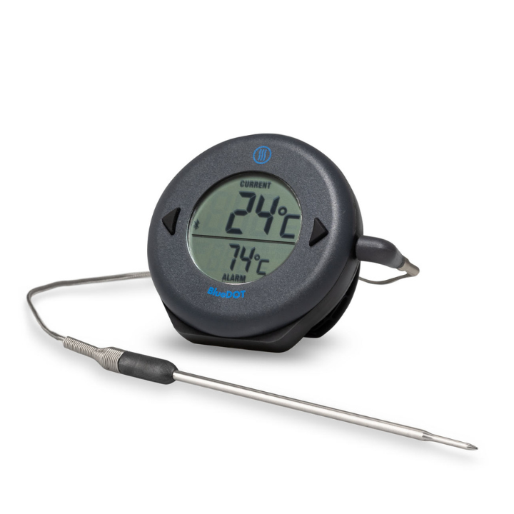 Zwart ronde BlueDOT thermometer met digitale display, toont huidige temperatuur 76°F en alarm 165°F. Bluetooth-icoon en bedieningsknoppen zichtbaar voor gebruik in keuken of op kookplaat.
