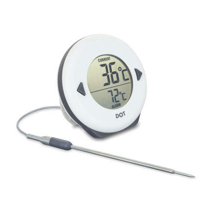 Een witte, ronde digitale thermometer met zwarte knoppen, die de huidige temperatuur van 34°C en de alarmwaarde van 75°C weergeeft. Geschikt voor keuken- en badkamergebruik.